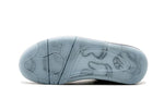 Air Jordan 4 Retro KAWS x 'Gris frío'